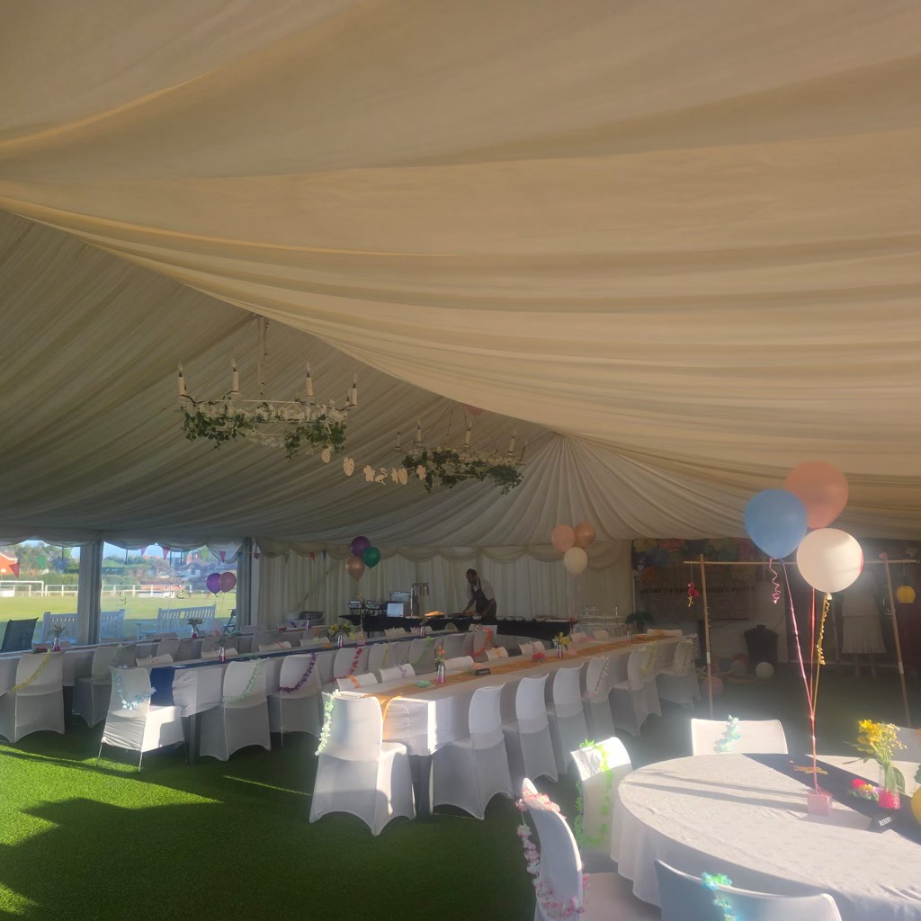 White Tables In Outdoor Marquee For Baby Shower